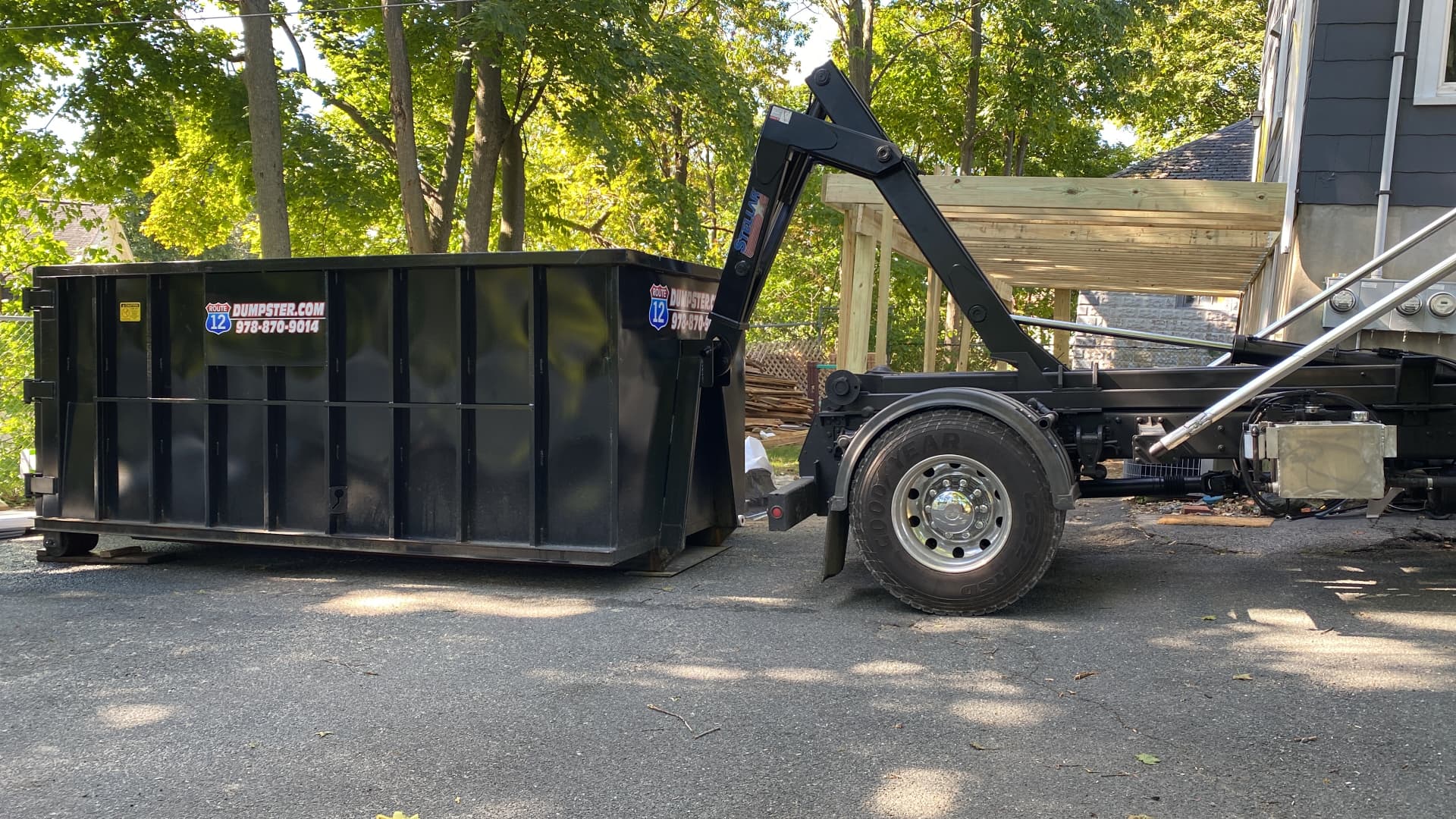 Route 12 dumpster placed in a residential driveway