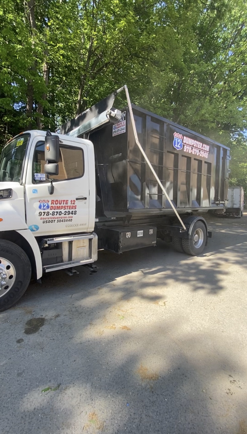 Route 12 Dumpsters truck loaded with a dumpster